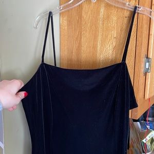 Black velvet spaghetti strap dress.
